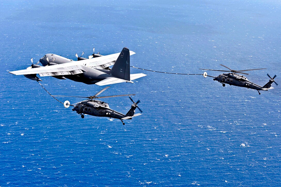 An MC-130P Combat Shadow refuels two HH-60G Pave Hawks as they fly to Osan Air Base, South Korea, during exercise Pacific Thunder, Oct. 27, 2011. The Combat Shadow crew is assigned to the 17th Special Operations Squadron, and the Pave Hawks crew are assigned to the 33rd Rescue Squadron. Pacific Thunder is an annual 10-day exercise.  
