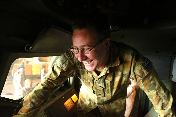 AQABA, Jordan - Major Darren Kaehre, Headquarters Operations Commander with the Australian Army, looks inside a Humvee during a tour of a Maritime Prepositioning Ship, the USNS 1st Lt. Baldomero Lopez, May 28, 2014, at the Port of Aqaba, Jordan. Approximately 30 generals from five different continents participated in the event, which demonstrated Maritime Prepositioning Force capabilities. The tour was a part of Exercise Eager Lion 2014, which is a recurring, multi-national exercise designed to strengthen military-to-military relationships and enhance regional security and stability by responding to modern-day security scenarios. (U.S. Marine Corps photo by Sgt. Laura Gauna/Released)


