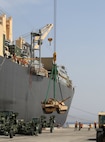 AQABA, Jordan - (May 28, 2014) An M1 Abrams tank is lifted aboard the Maritime Pre-Positioning vessel, USNS 1st LT Baldomero Lopez, and guided by members of the ship’s crew from Navy Cargo Handler Battalion One in support of Exercise Eager Lion 2014.  Eager Lion is a recurring, multinational exercise designed to strengthen military-to-military relationships, increase interoperability between partner nations and enhance regional security and stability.  (U.S. Marine Corps photo by Master Sgt. Will Price/Released)