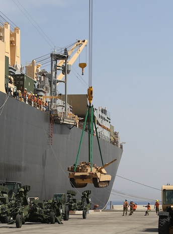 AQABA, Jordan - (May 28, 2014) An M1 Abrams tank is lifted aboard the Maritime Pre-Positioning vessel, USNS 1st LT Baldomero Lopez, and guided by members of the ship’s crew from Navy Cargo Handler Battalion One in support of Exercise Eager Lion 2014.  Eager Lion is a recurring, multinational exercise designed to strengthen military-to-military relationships, increase interoperability between partner nations and enhance regional security and stability.  (U.S. Marine Corps photo by Master Sgt. Will Price/Released)