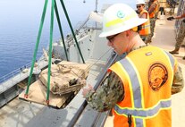AQABA, Jordan - (May 28, 2014) U.S. Navy Lt. Jonathon Lavery, Navy Cargo Handler Battalion One, officer-in-charge, and Akron, Ohio native, supervises operations as a 60-ton M1 Abrams tank is lowered aboard the USAV SP/4 James A. Loux (LSV-6), from the Maritime Pre-Positioning vessel, USNS 1st LT Baldomero Lopez in support of Exercise Eager Lion 2014.  Eager Lion is a recurring, multinational exercise designed to strengthen military-to-military relationships, increase interoperability between partner nations and enhance regional security and stability.  (U.S. Marine Corps photo by Master Sgt. Will Price/Released)