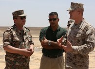 AQABA, Jordan - (May 28, 2014) Mussa Hijazin, cultural advisor to Command Element Marine Corps Forces Central Command Forward,  translates for Brig. Gen. Gregg Olson, commanding general, CE MARFOR CENTCOM (FWD),  and Jordanian Armed Forces,  Brig. Gen.  Ali Al-Domi, commanding general, 99th Armoured, about the live-fire ranges to be conducted during  Eager Lion 2014, at a base near Petra, Jordan,  May 28. Eager Lion is a recurring, multinational exercise designed to strengthen military-to-military relationships, increase interoperability between partner nations and enhance regional security and stability.   (U.S. Marine Corps photo by; Sgt James A. Hall, CE MARFOR CENTCOM (FWD) Combat Camera/Not Released)
