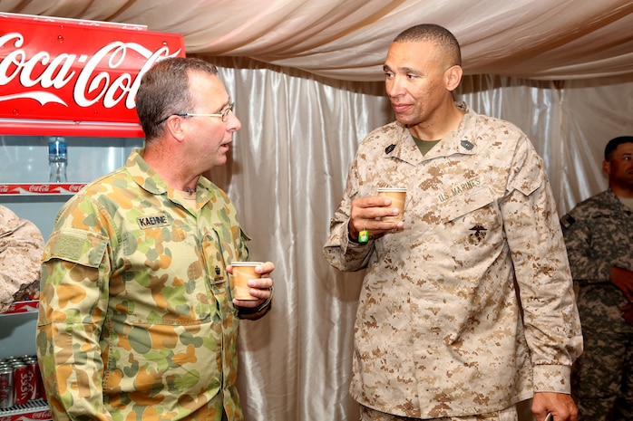 AQABA, Jordan - May 25, 2014, U.S. Marine Corps Master Sgt. James Harris, protocol chief, Command Element Marine Forces Central Command Forward, speaks with Australian Army Maj. Darren Kaehne, at a coalition meeting during Exercise Eager Lion 2014, at a base near Aqaba, Jordan, May 25.  Eager Lion is a recurring, multi-national exercise designed to strengthen military-to-military relationships and enhance regional security and stability by responding to modern-day security scenarios. (U.S. Marine Corps photo by Sgt. James A. Hall/Released)