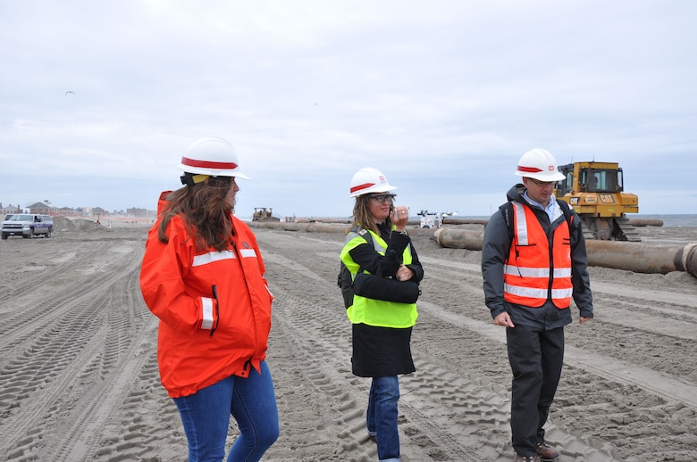 Representatives from the U.S. Army Corps of Engineers, New York District, conduct a walk-through of the project site with German reporter Petrina Engelke. The Corps of Engineers is currently in the middle of placing an estimated 3.5M cubic yards of sand onto the Rockaway coastline to improve flood risk reduction measures for future storms. 