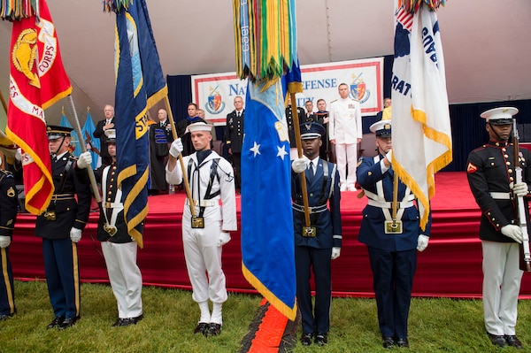Honor Guard members present the colors during the 2014 National Defense University graduation ceremony, on Fort Lesley J. McNair, Washington, D.C., June 12, 2014. NDU is dedicated to being the premier national security institution focused on advanced joint education, leader development and scholarship.