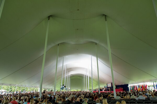 Attendees fill the tent where the 2014 National Defense University graduation ceremony was held on Fort Lesley J. McNair, Washington, D.C., June 12, 2014. NDU is dedicated to being the premier national security institution focused on advanced joint education, leader development and scholarship.