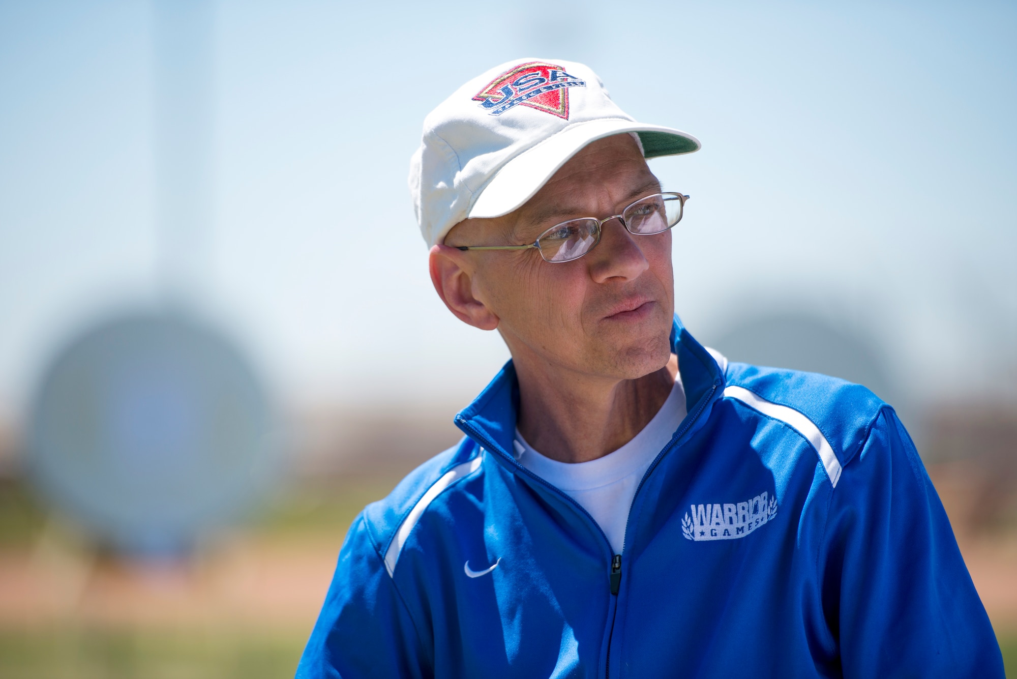 Retired Senior Master Sgt. Mike Sanders enjoys a moment of rest April 10, 2014, during the Air Force Trials at Nellis Air Force Base, Nev. Sanders is a cancer survivor and an active participant in Air Force Wounded Warrior program. Sanders was told he was free of the disease in 2008 and has been using sports as part of his recovery process. (U.S. Air Force photo/Senior Airman Jette Carr)
