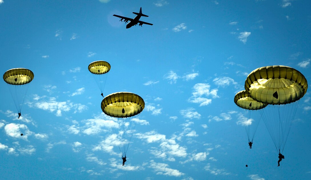 Paratroopers jump onto the Iron Mike drop zone, June 8, 2014, outside St. Mere Eglise, France. More than 600 U.S., German, Dutch and French service members jumped to honor the paratroopers that jumped into Normandy on D-Day. The event was one of several commemorations of the 70th Anniversary of D-Day operations conducted by Allied forces during World War II June 5-6, 1944. (U.S. Air Force photo/Staff Sgt. Sara Keller)