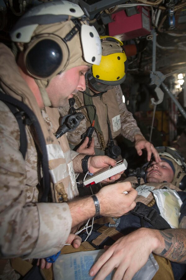 U.S. 5TH FLEET AREA OF RESPONSIBILITY (June 2, 2014) U.S. Navy Corpsmen with Combat Logistics Battalion 22, 22nd Marine Expeditionary Unit (MEU), treat a simulated casualty aboard an MV-22 Osprey tiltrotor aircraft during a tactical evacuation drill. The 22nd MEU is deployed with the Bataan Amphibious Ready Group as a theater reserve and crisis response force throughout U.S. Central Command and the U.S. 5th Fleet area of responsibility. (U.S. Marine Corps photo by Cpl. Manuel A. Estrada/Released)