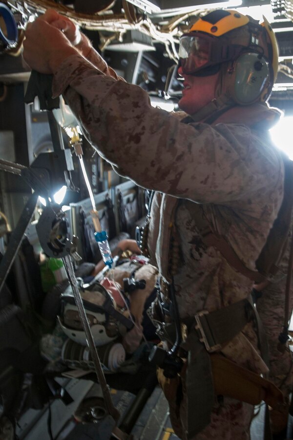 U.S. 5TH FLEET AREA OF RESPONSIBILITY (June 2, 2014) U.S. Navy Hospitalman Jason Ouellette, Combat Logistics Battalion 22, 22nd Marine Expeditionary Unit (MEU), corpsman and native of Lewiston, Maine, secures an IV bag aboard an MV-22 Osprey tiltrotor aircraft during a tactical evacuation drill. The 22nd MEU is deployed with the Bataan Amphibious Ready Group as a theater reserve and crisis response force throughout U.S. Central Command and the U.S. 5th Fleet area of responsibility. (U.S. Marine Corps photo by Cpl. Manuel A. Estrada/Released)