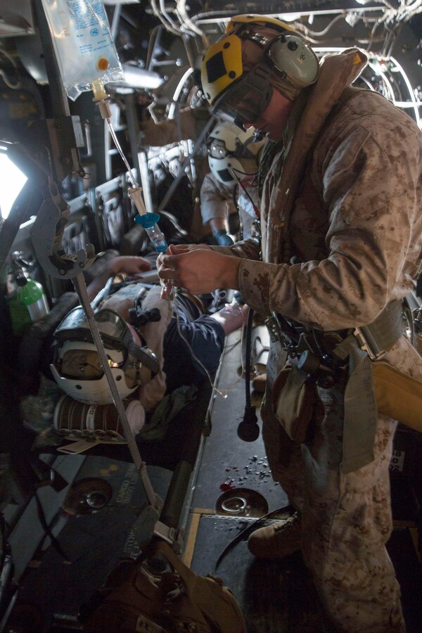 U.S. 5TH FLEET AREA OF RESPONSIBILITY (June 2, 2014) U.S. Navy corpsmen with Combat Logistics Battalion 22, 22nd Marine Expeditionary Unit (MEU), treat a simulated casualty aboard an MV-22 Osprey tiltrotor aircraft during a tactical evacuation drill. The 22nd MEU is deployed with the Bataan Amphibious Ready Group as a theater reserve and crisis response force throughout U.S. Central Command and the U.S. 5th Fleet area of responsibility. (U.S. Marine Corps photo by Cpl. Manuel A. Estrada/Released)