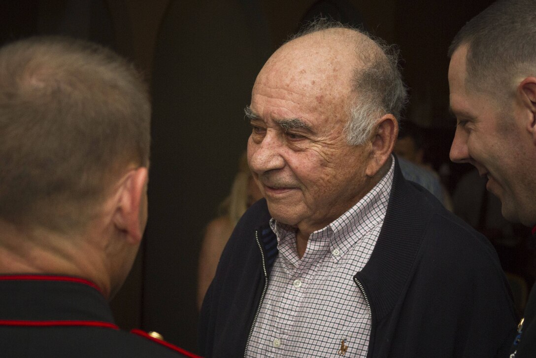 Melvin Kabik, a World War II veteran, shares a light-hearted moment with members of Recruiting Station Baltimore’s command group during his 90th birthday party in Baltimore, Md., June 1, 2014. Kabik, a native of Baltimore, enlisted in the Marine Corps when he was 18 years old and became a radio operator in 3rd Battalion, 4th Marine Regiment, and fought in the battles of the Marianas and Okinawa.  (US Marine Corps photo by Sgt Bryan Nygaard/Released)