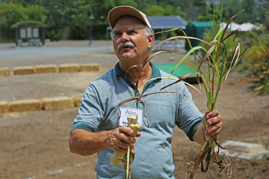 Paul Sommers, the project director for the Agricultural Development for Armed Forces Pre-Deployment Training, explains how plants can help prevent erosion at the San Diego Botanical Gardens in Encinitas, Calif., June 10, 2014. The training is designed to prepare service members to provide humanitarian aid in allied countries.