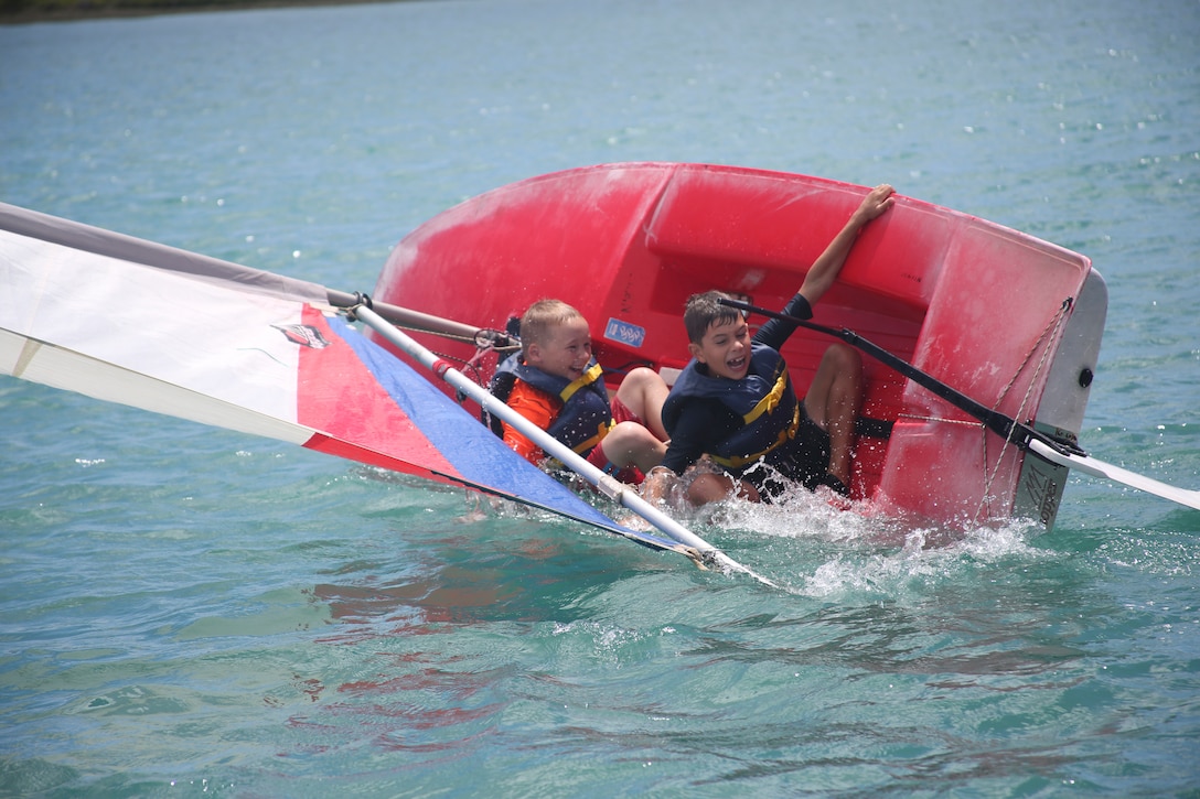 Students participate in capsizing drills where they dip their sail boat and need to right it from the water. (U.S. Marine Corps photo by Cpl. Janelle Y. Villa)