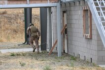 A Marine from 1st Reconnaissance Battalion runs for cover after placing an explosive charge during a Methods of Entry proficiency training exercise aboard Camp Pendleton Calif., June 10.  During the exercise, raid scenarios were tailored for the event to keep the Marines in an operational mindset while honing their skill set for future deployments as the Maritime Raid Force in support of Marine Expeditionary Units. 
