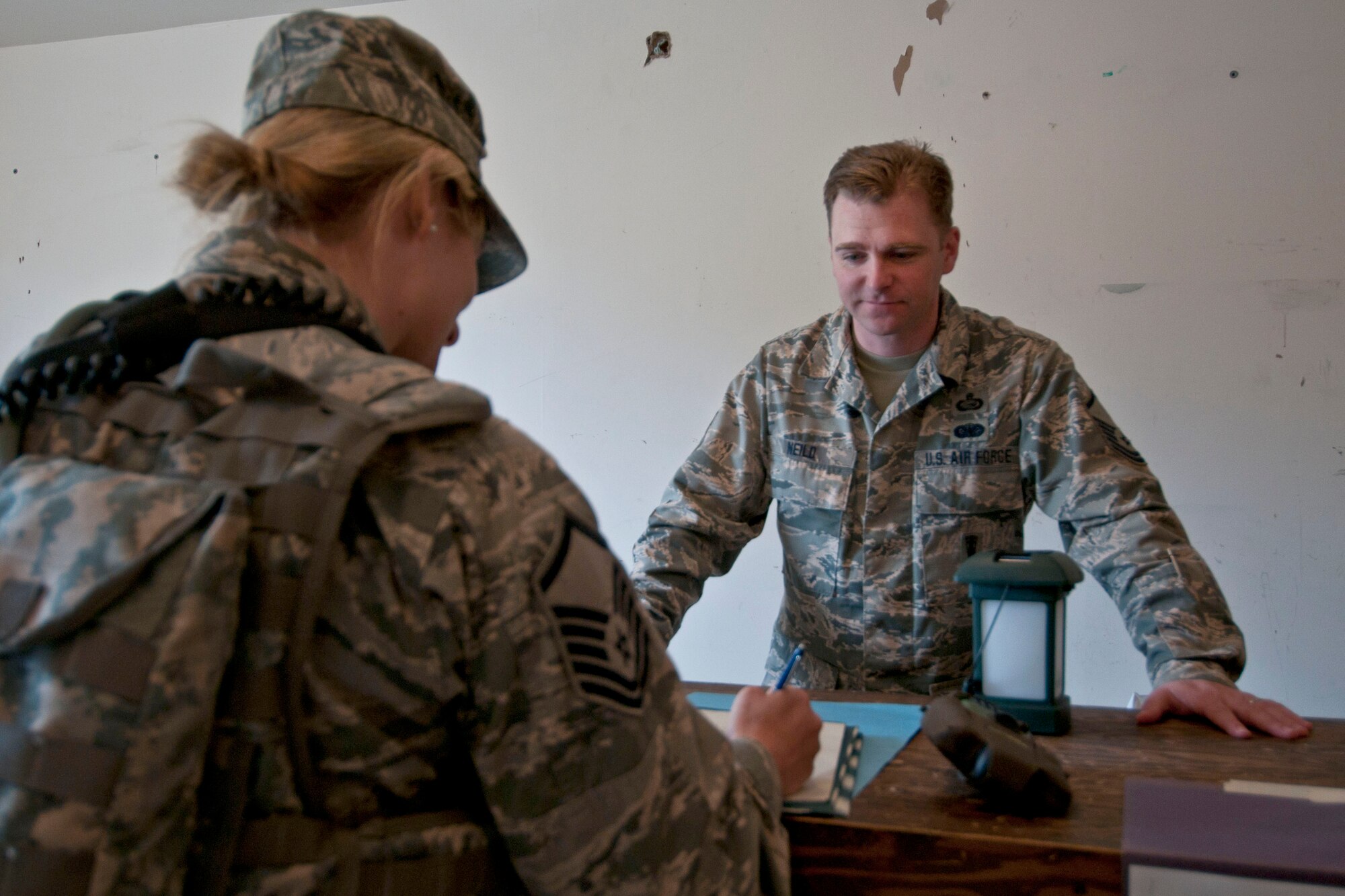 JOINT BASE ELMENDORF-RICHARDSON, Alaska -- Master Sgt. Brian Neild, the Personnel Support for Contingency Operations team chief and the personnel systems manager from the 176 Force Support Flight, ensures accountability during an exercise here at Camp Mad Bull here June 9, 2014. The 176 Mission Support Group and the 176 Medical Group participated as part of Polar Guardian 14-2. (U.S. Air National Guard photo by Staff Sgt. N. Alicia Halla/ Released)