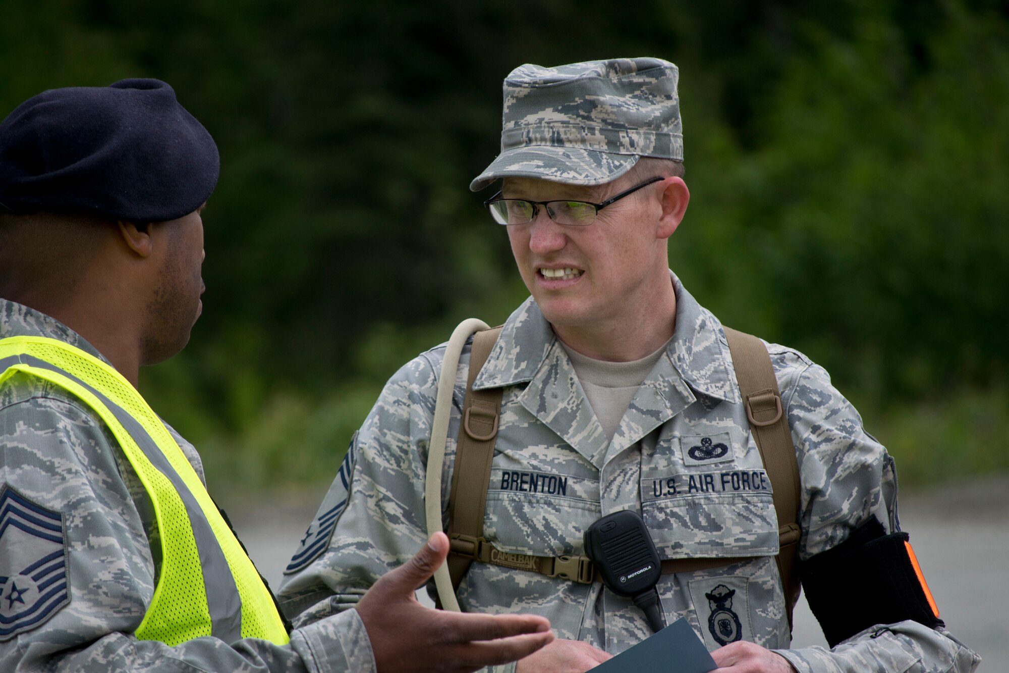 JOINT BASE ELMENDORF-RICHARDSON, Alaska-- Chief Master Sgt. Curtis Brenton, the 176 Security Forces superintendent coordinates matters during an exercise at Camp Mad Bull here June 10, 2014. The 176 Mission Support Group and the 176 Medical Group participated as part of Polar Guardian 14-2. (U.S. Air National Guard photo by Capt. John Callahan/ Released)