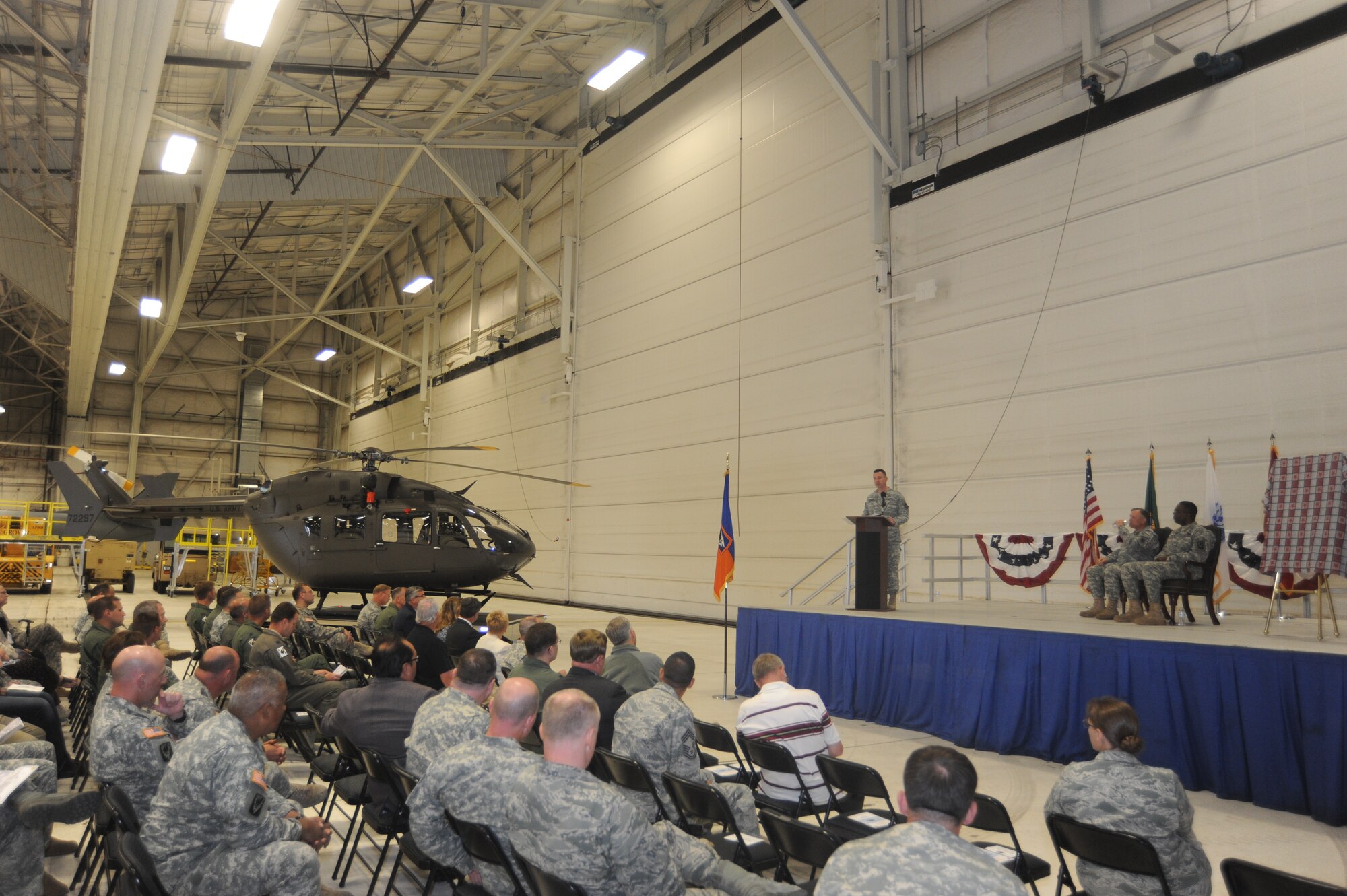 Maj. Raymond Leonard of the Washington National Guard speaks during the unveiling ceremony of the UH-72A Lakota helicopter at Fairchild Air Force Base, Wash., June 13, 2014. The Lakota is an update to the National Guard's aging fleet. (U.S. Air Force photo by Airman 1st Class Sam Fogleman/Released)