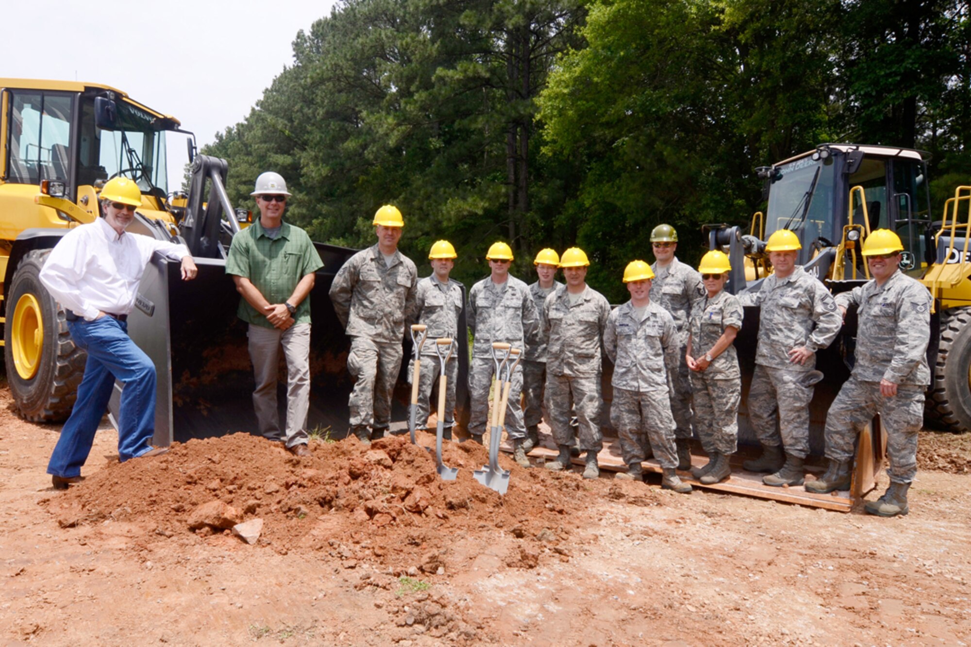 Members of the 94th Civil Engineering Squadron and  622nd Civil Engineering Group Expeditionary Combat Support Training and Certification Center participate in a ground breaking ceremony at the Dobbins dead runway May 30. The 622nd CEG ECSTCC will construct a storage facility that will house equipment for Explosive Ordnance Disposal training. (U.S. Air Force photo/Don Peek)