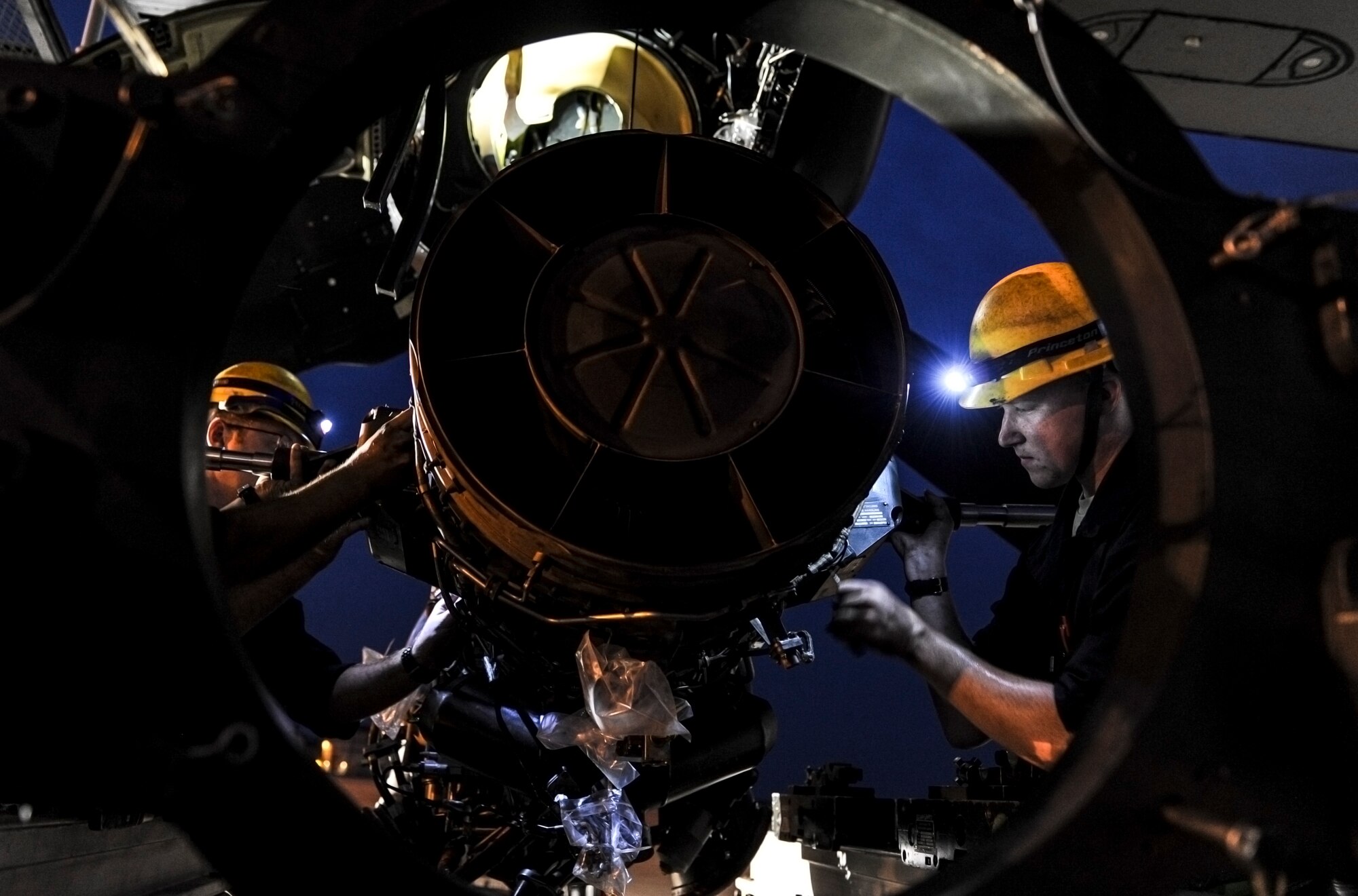 Airmen from the 801st Special Operations Aircraft Maintenance Squadron place a CV-22 Osprey engine on a rack during maintenance on Hurlburt Field, Fla., June 13, 2014. The 801st SOAMXS was established June 1, 2009, but was first designated as the 16th Floating Repair Unit May 18, 1944. (U.S. Air Force photo/Senior Airman Christopher Callaway) 
