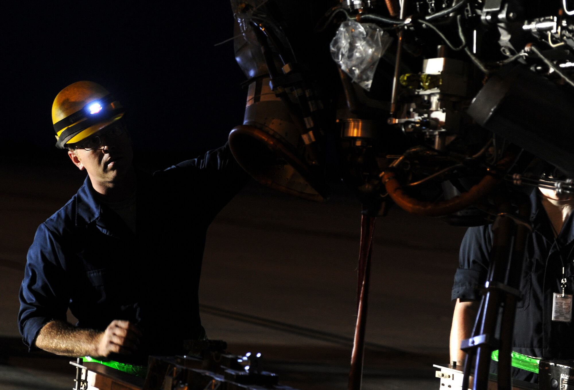 Staff Sgt. Perry Otillio, 801st Special Operations Aircraft Maintenance Squadron dedicated crew chief, helps remove a CV-22 Osprey engine on Hurlburt Field, Fla., June 13, 2014. The 801st SOAXMS Airmen performed further checks and maintenance to fix the Osprey. (U.S. Air Force photo/Senior Airman Christopher Callaway) 