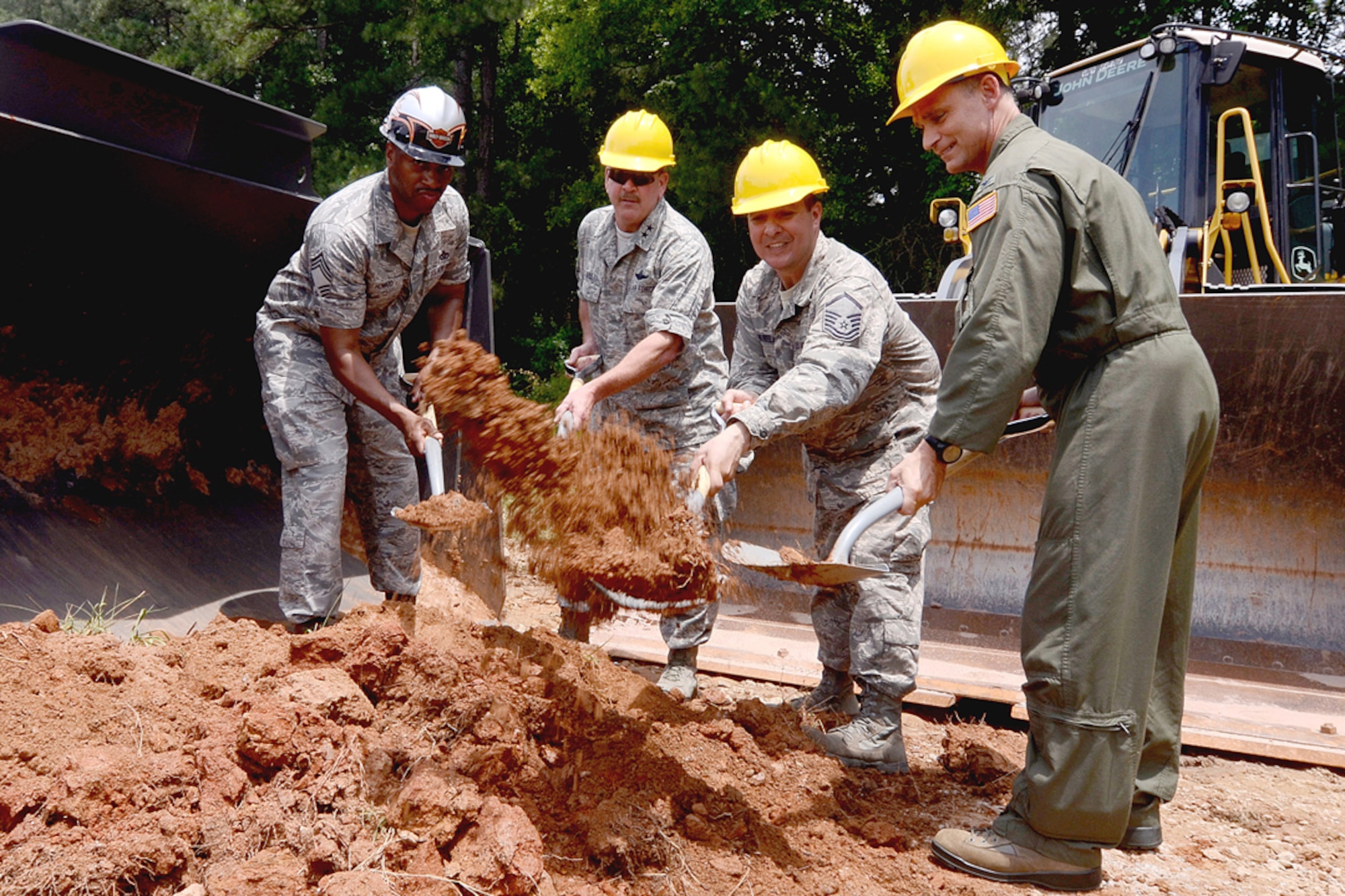 (Left to right) Chief Master Sgt. Leonard Howard, 622nd Civil Engineering Group Expeditionary Combat Support Training and Certification Center commandant, Maj. Gen. Mark Kyle, 22nd Air Force commander, Master Sgt. Carlos Varela, 934th Civil Engineering Squadron and project manager, and Col. Brett Clark, 94th Airlift Wing commander, participate in a ground breaking ceremony at the Dobbins dead runway May 30. The 622nd Civil Engineering Group Expeditionary Combat Support Training and Certification Center will construct a storage facility that will house equipment for Explosive Ordnance Disposal training. (U.S. Air Force photo/Don Peek)