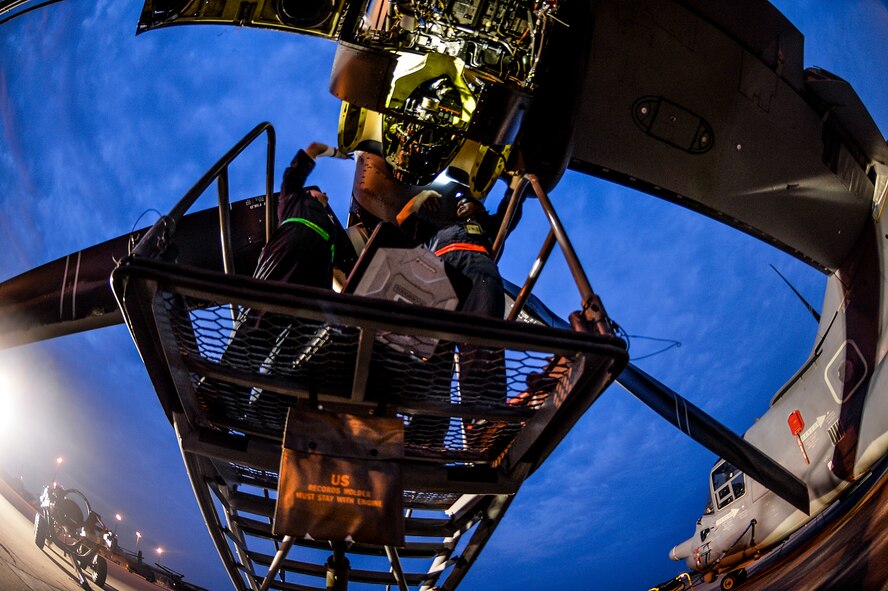Airmen from the 801st Special Operations Aircraft Maintenance Squadron work on a a CV-22 Osprey engine on Hurlburt Field, Fla., June 13, 2014. The 801st SOAMXS performs equipment maintenance in support of worldwide special operations missions. (U.S. Air Force photo/Senior Airman Christopher Callaway) 