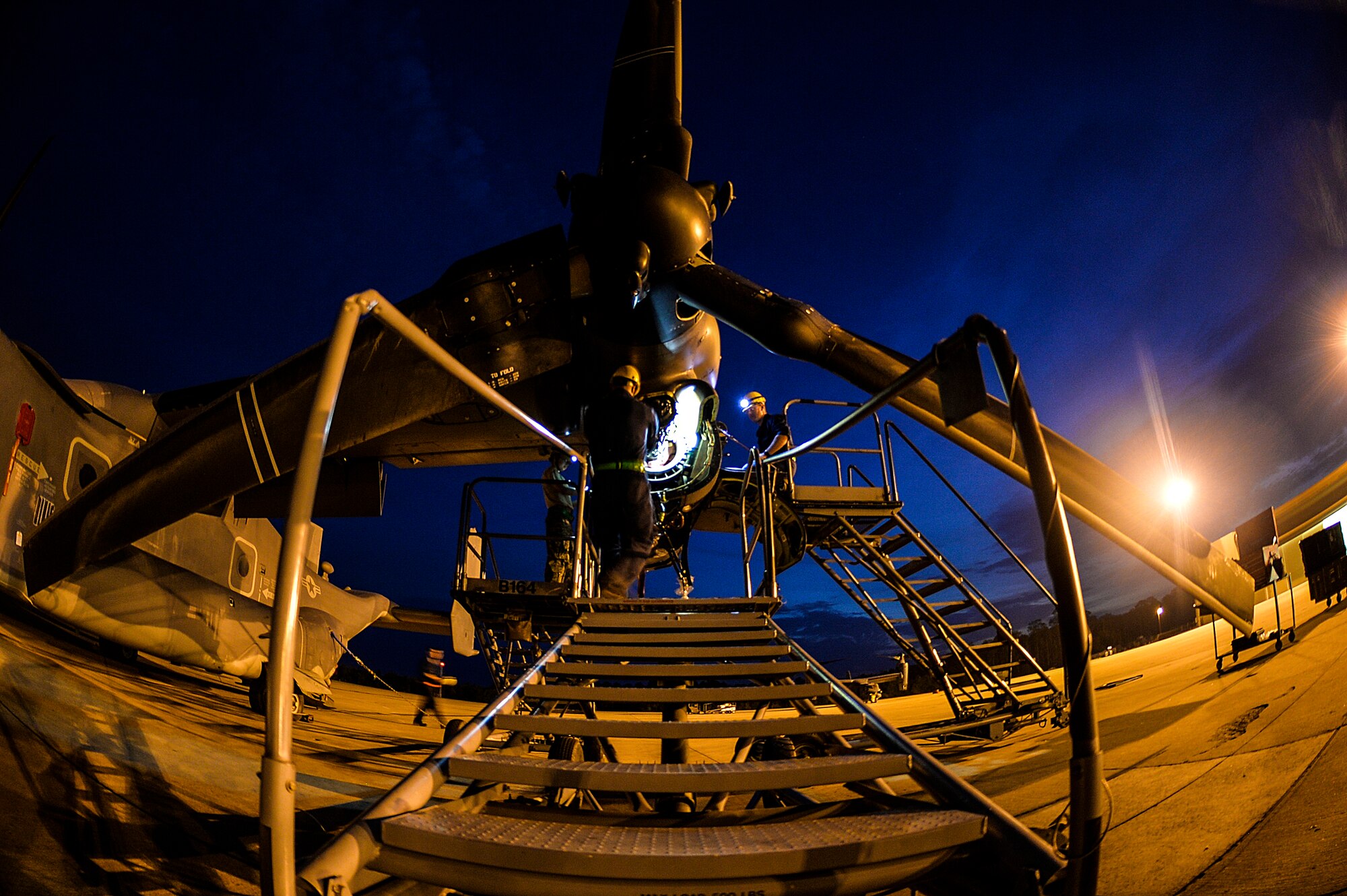Airmen from the 801st Special Operations Aircraft Maintenance Squadron work on a CV-22 Osprey engine on Hurlburt Field, Fla., June 13, 2014. The Osprey can conduct long-range infiltration, exfiltration and resupply missions for special operations forces. (U.S. Air Force photo/Senior Airman Christopher Callaway)