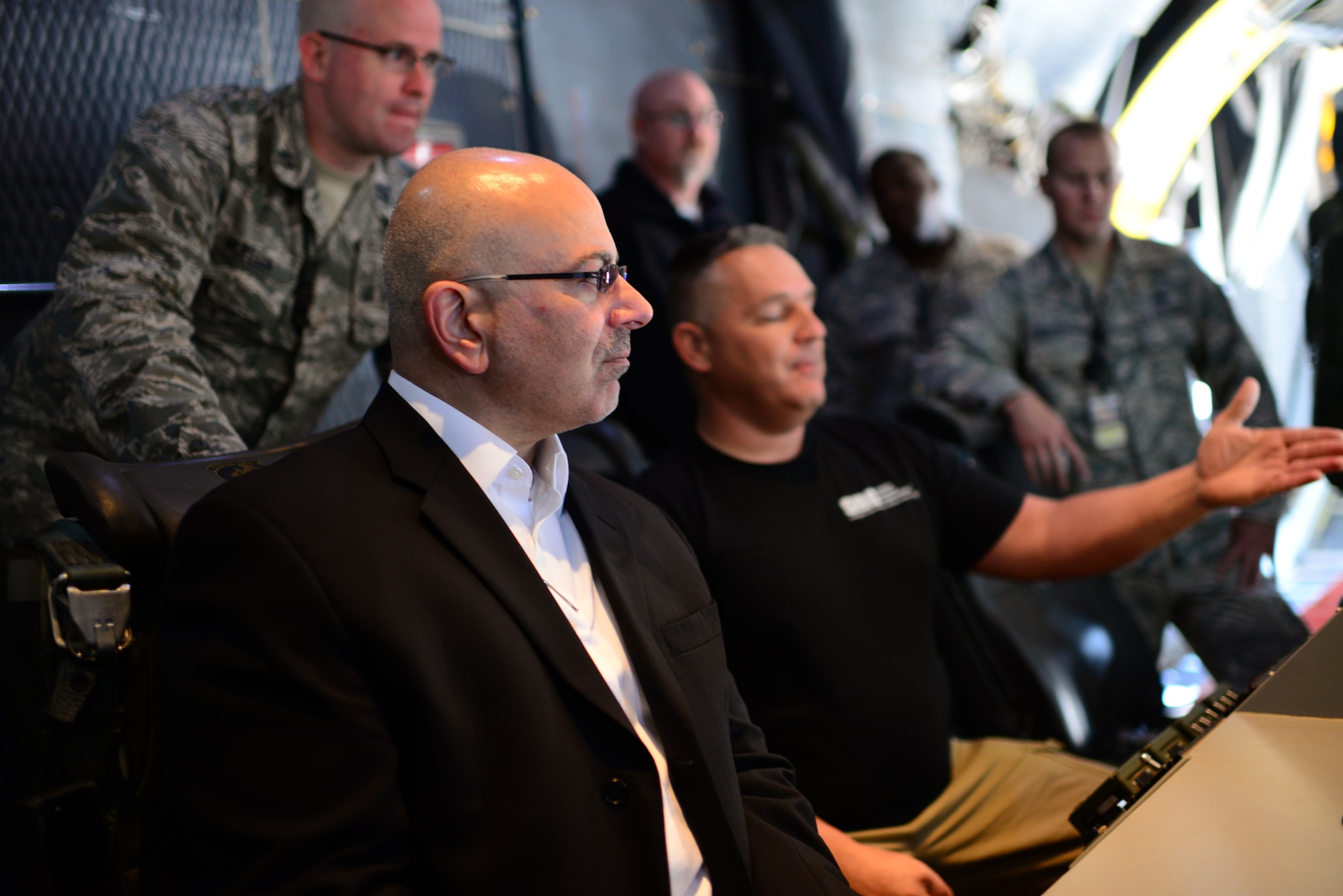 John Johns, Deputy Assistant Secretary of Defense for maintenance policy and programs, looks on as Airmen and civilians who maintain the AC-130W Stinger II describe the gunship’s sensor capabilities.  Johns visited the base to congratulate the 27th Special Operations Maintenance Group on receiving the Secretary of Defense Field Level Maintenance Excellence Award. (U.S. Air Force photo/Airman 1st Class Shelby Kay-Fantozzi) 