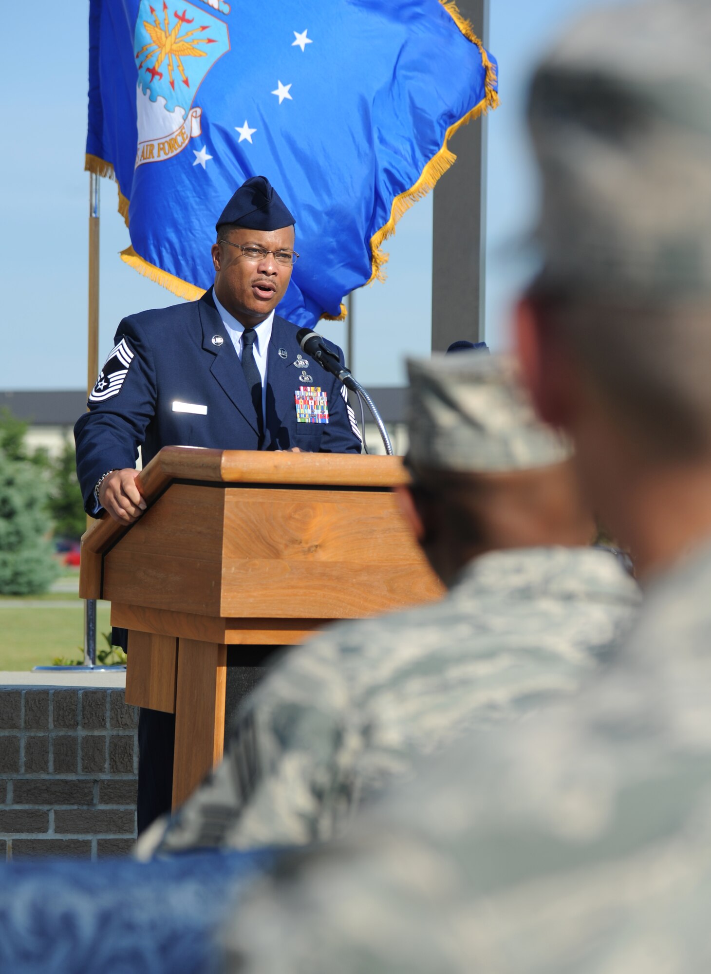Chief Master Sgt. Roger Thornton, 607th Air Operations Center, Osan Air Base, Republic of Korea, delivers remarks  during a re-dedication ceremony honoring the late Airman 1st Class Antoine Holt June 12, 2014, in front of Avery Manor at Keesler Air Force Base, Miss.  Holt, a former student in the 334th TRS, lost his life April 10, 2004 while at Balad Air Base, Iraq, when his tent was hit by a mortar attack.  (U.S. Air Force photo by Kemberly Groue)