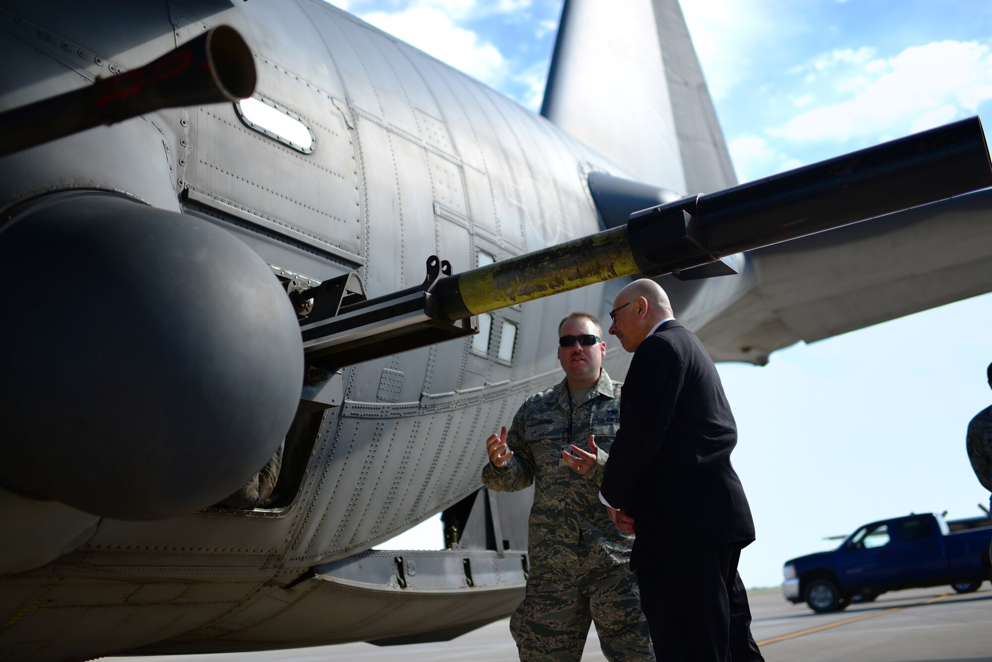 U.S. Air Force Tech. Sgt. Adam Terns, 27th Special Operations Maintenance Squadron armament expeditor, explains the capabilities of the 105 mm howitzer on the AC-130H Spectre to John Johns, Deputy Assistant Secretary of Defense for maintenance policy and programs. Johns visited the base to congratulate the 27th Special Operations Maintenance Group on receiving the Secretary of Defense Field Level Maintenance Excellence Award. (U.S. Air Force photo/Airman 1st Class Shelby Kay-Fantozzi) 