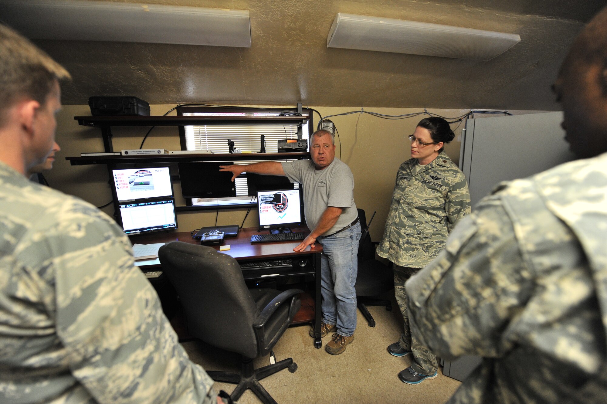 FORT SILL, Okla. – Rick DeMars, project manager at Falcon Range, shows U.S. Army Soldiers from the Fort Sill Office of the Inspector General and U.S. Air Force Airmen from the 97th Air Mobility Wing IG, how the range uses its laser targeting scoring systems during a joint IG training day at Falcon Range on Fort Sill June 11, 2014. The joint training provided Soldiers and Airmen to learn similarities and differences between the two service branches IG processes. (U.S. Air Force photo by Senior Airman Dillon Davis/Released)