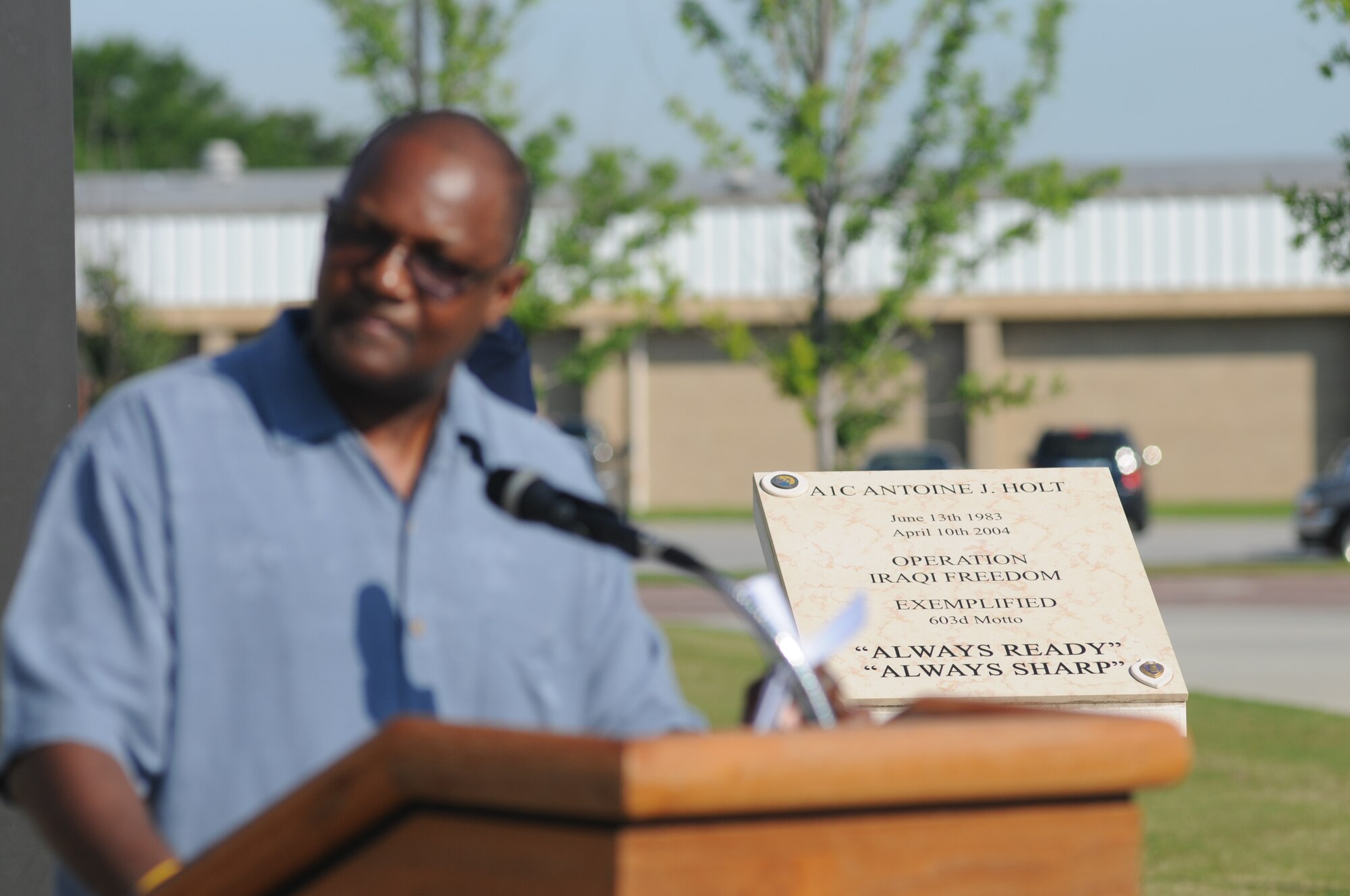 A memorial is unveiled for the late Airman 1st Class Antoine Holt during a re-dedication ceremony June 12, 2014, in front of Avery Manor at Keesler Air Force Base, Miss.  Holt, a former student in the 334th Training Squadron, lost his life April 10, 2004 while at Balad Air Base, Iraq, when his tent was hit by a mortar attack.  (U.S. Air Force photo by Kemberly Groue)