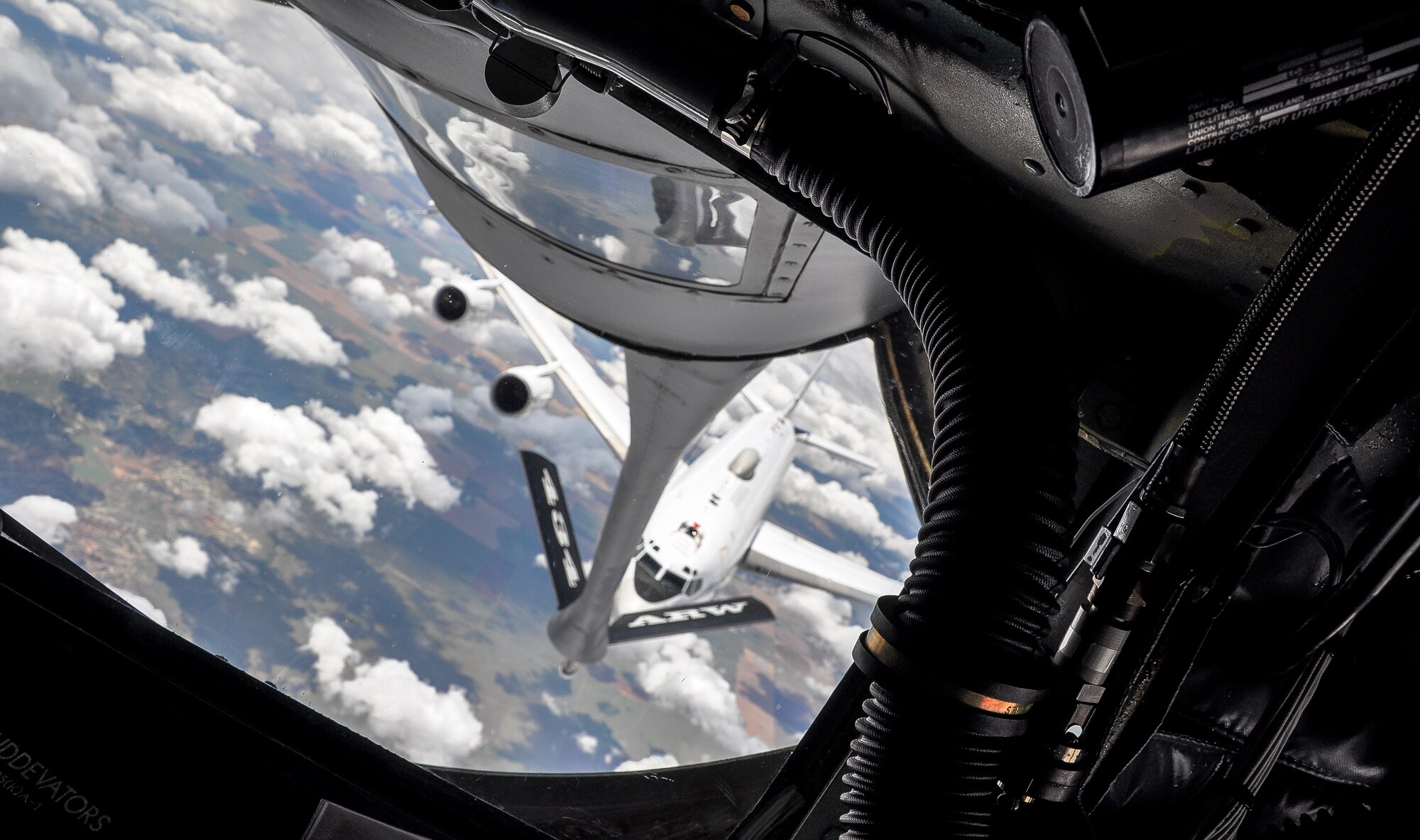 A U.S. Navy E-6 Mercury receives fuel from a KC-135R Stratotanker during an incnetive flight June 6, 2014 at Tinker Air Froce Base.  The incentive flight gave Airmen from the 507th Air Refueling Wing a chance to see a refueling in person.  (U.S. Air Force photo/Staff Sgt. Charles Taylor)