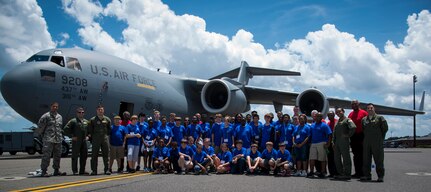 Students from the Take Flight! Aviation Camp, Tuskegee Airmen and C-17 Globemaster III crewmembers, pose for a group photo June 12, 2014, on the flight line at Joint Base Charleston, S.C. The purpose of the camp is to inspire students to pursue careers in aviation. (U.S. Air Force photo/ Airman 1st Class Clayton Cupit)