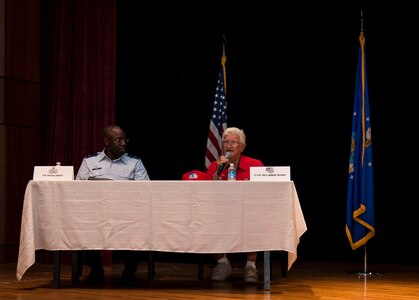 Retired Lt. Col. Robert Hughes, an original Tuskegee Airman instructor, speaks to a crowd of students and service members June 12, 2014, at the Base Theater on Joint Base Charleston, S.C. Hughes told stories of his past to students from the Take Flight! Aviation Camp where they learned the history of the Tuskegee Airmen. (U.S. Air Force photo/ Airman 1st Class Clayton Cupit)