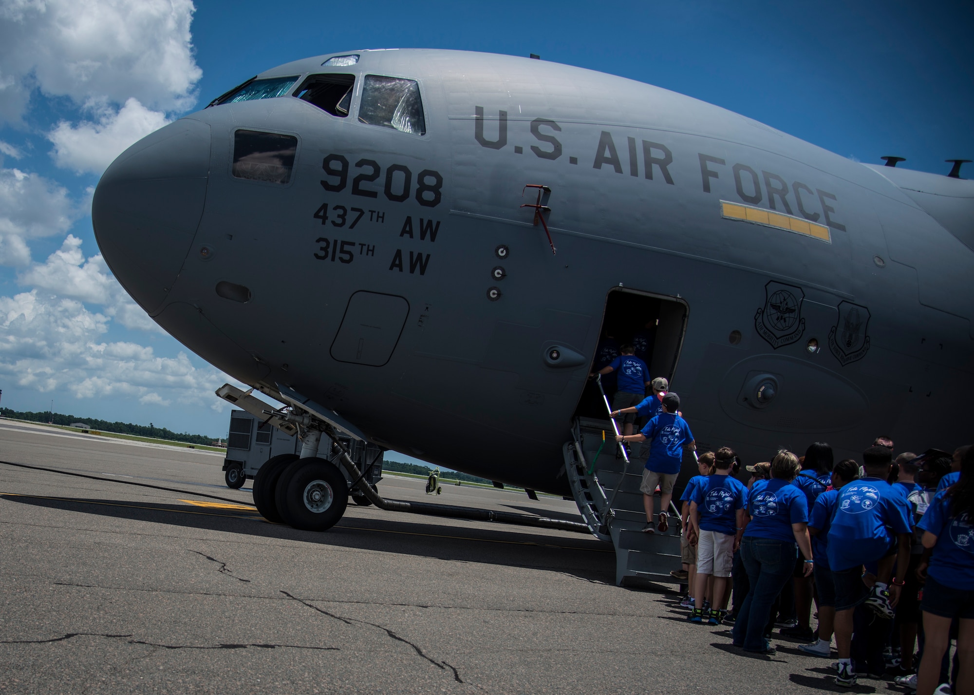 Students from the Take Flight! Aviation Camp board a C-17 Globemaster III June 12, 2014, on the flightline at Joint Base Charleston, S.C. The students got an inside look at one of JB Charleston’s C-17’s and also got to hear stories from retired Lt. Col. Robert Hughes, an original Tuskegee Airman instructor. (U.S. Air Force photo/ Airman 1st Class Clayton Cupit)
