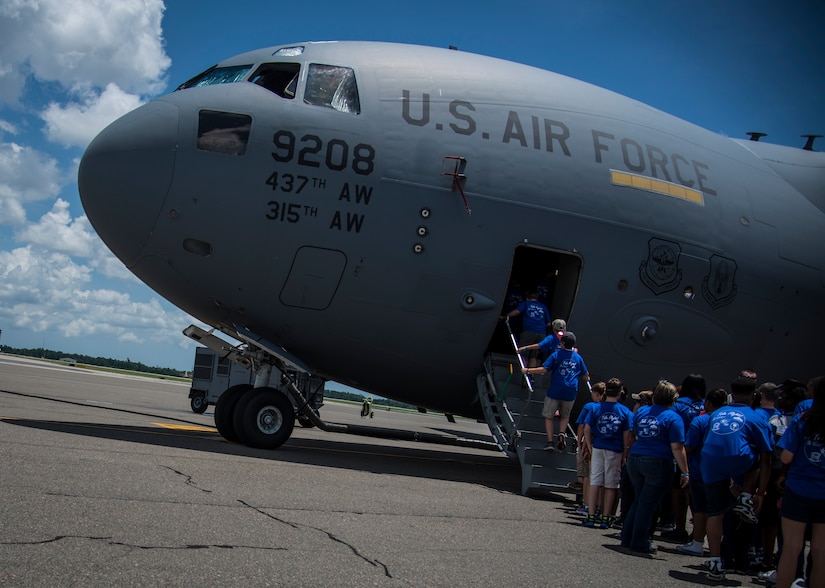 Students from the Take Flight! Aviation Camp board a C-17 Globemaster III June 12, 2014, on the flightline at Joint Base Charleston, S.C. The students got an inside look at one of JB Charleston’s C-17’s and also got to hear stories from retired Lt. Col. Robert Hughes, an original Tuskegee Airman instructor. (U.S. Air Force photo/ Airman 1st Class Clayton Cupit)