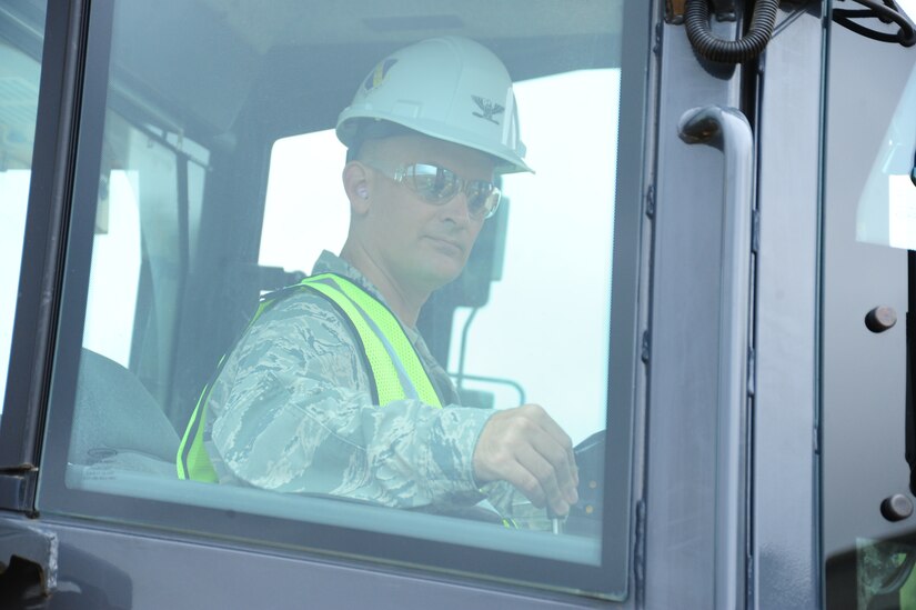 Col. Bill Knight, 11th Wing/Joint Base Andrews commander, operates a construction vehicle at the site currently in development for Heritage Park near the main entrance at Joint Base Andrews, Md., June 5, 2014. The park will be a new landmark on base to celebrate military heritage and culture. (U. S. Air Force photo/Airman 1st Class Joshua R. M. Dewberry) 
