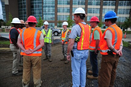 Col. Bill Knight, 11th Wing/Joint Base Andrews commander, speaks to 11th Civil Engineer Squadron Airmen about the vision of the Heritage Park project near the main entrance at Joint Base Andrews, Md., June 5, 2014. The groundwork for the park is slated to be completed by the end of June. (U. S. Air Force photo/Airman 1st Class Joshua R. M. Dewberry) 