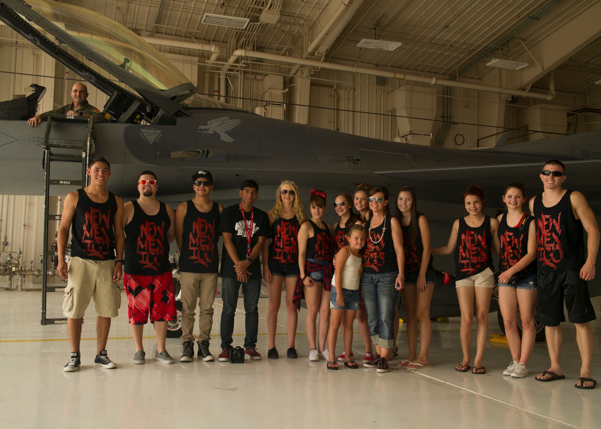 Colonel Rodney Petithomme, 54th Fighter Group commander, and the Showtime Studio dancers pose for a photo with the F-16 Fighting Falcon during a tour at Holloman Air Force Base, N.M., June 9. Members from Showtime Studio, a hip-hop studio located at the Boys and Girls Club in Alamogordo, N.M., visited the 54th Fighter Group. The members got a hands on look at the squadron flight equipment and F-16 Fighting Falcon. (U.S. Air Force photo by Airman 1st Class Leah Ferrante/Released) 

