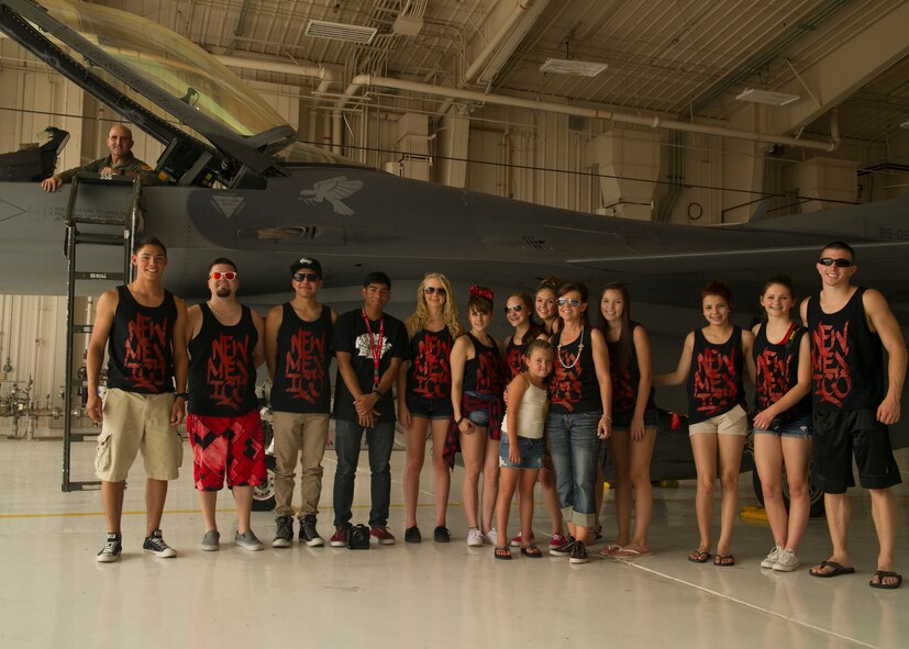 Colonel Rodney Petithomme, 54th Fighter Group commander, and the Showtime Studio dancers pose for a photo with the F-16 Fighting Falcon during a tour at Holloman Air Force Base, N.M., June 9. Members from Showtime Studio, a hip-hop studio located at the Boys and Girls Club in Alamogordo, N.M., visited the 54th Fighter Group. The members got a hands on look at the squadron flight equipment and F-16 Fighting Falcon. (U.S. Air Force photo by Airman 1st Class Leah Ferrante/Released) 

