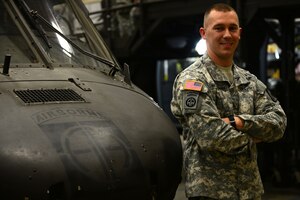 United States Army Staff Sgt. Brandan Beiermann, 2nd Battalion, 210th Aviation Regiment, B Company Black Hawk instructor, received a Purple Heart at Fort Eustis, Va., after suffering a traumatic brain injury while deployed to Forward Operating Base Shank, Afghanistan. Beiermann, from Harvel, Ill., has been able to recover and continue his career in the Army. (U.S. Air Force photo by Airman 1st Class Kimberly Nagle/Released)