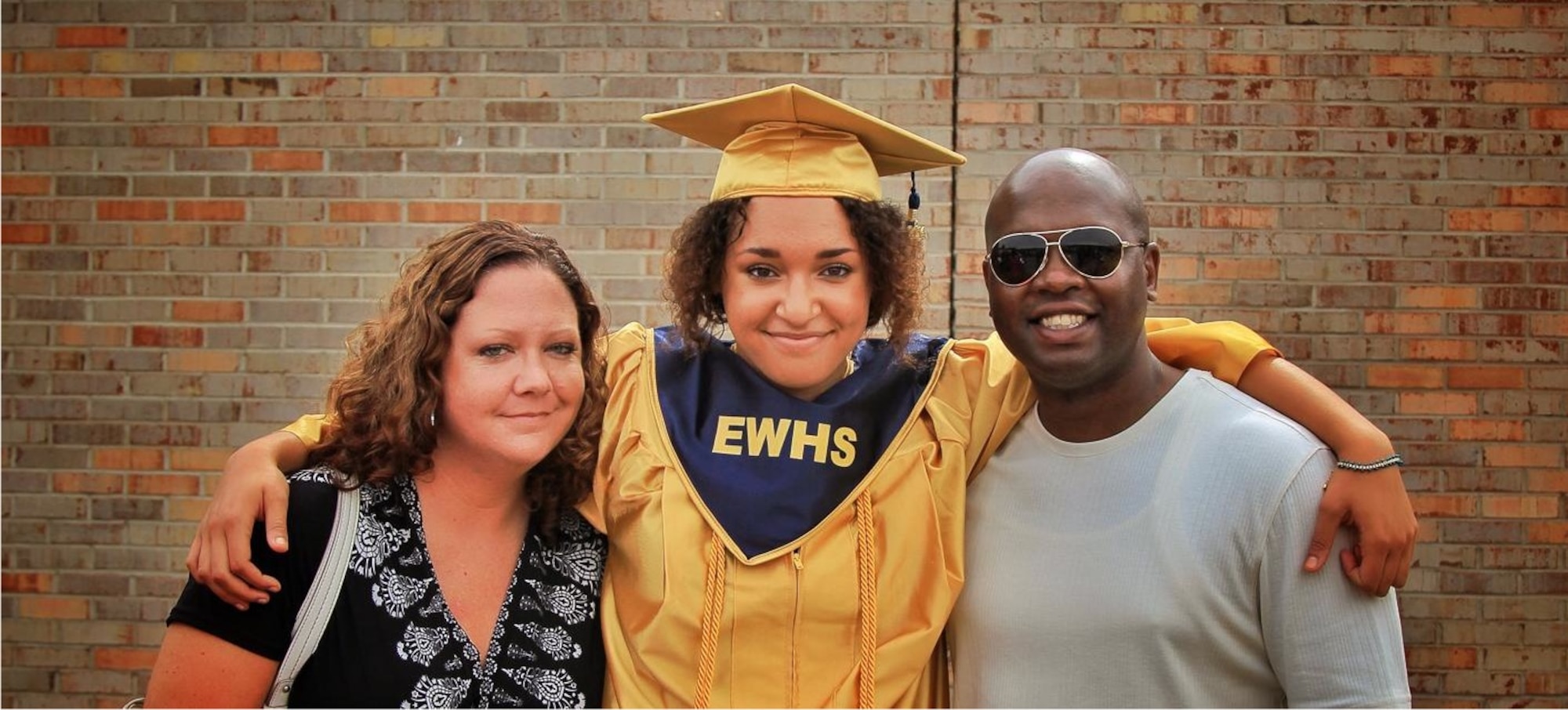 Anne Risku-Smith (left), mother of Kamrie Risku (center), and Master Sgt. Anthony Smith (right), 4th Medical Group patient advocate celebrate Risku’s recent high school graduation in Goldsboro, North Carolina. Risku was awarded the $50,000 Corvias Foundation Our Future Scholarship to be used at the university of her choice. The scholarship is awarded annually to dependents of service members assigned to installations where Corvias Military Living provides housing. (U.S. Air Force photo/Airman 1st Class Aaron J. Jenne)