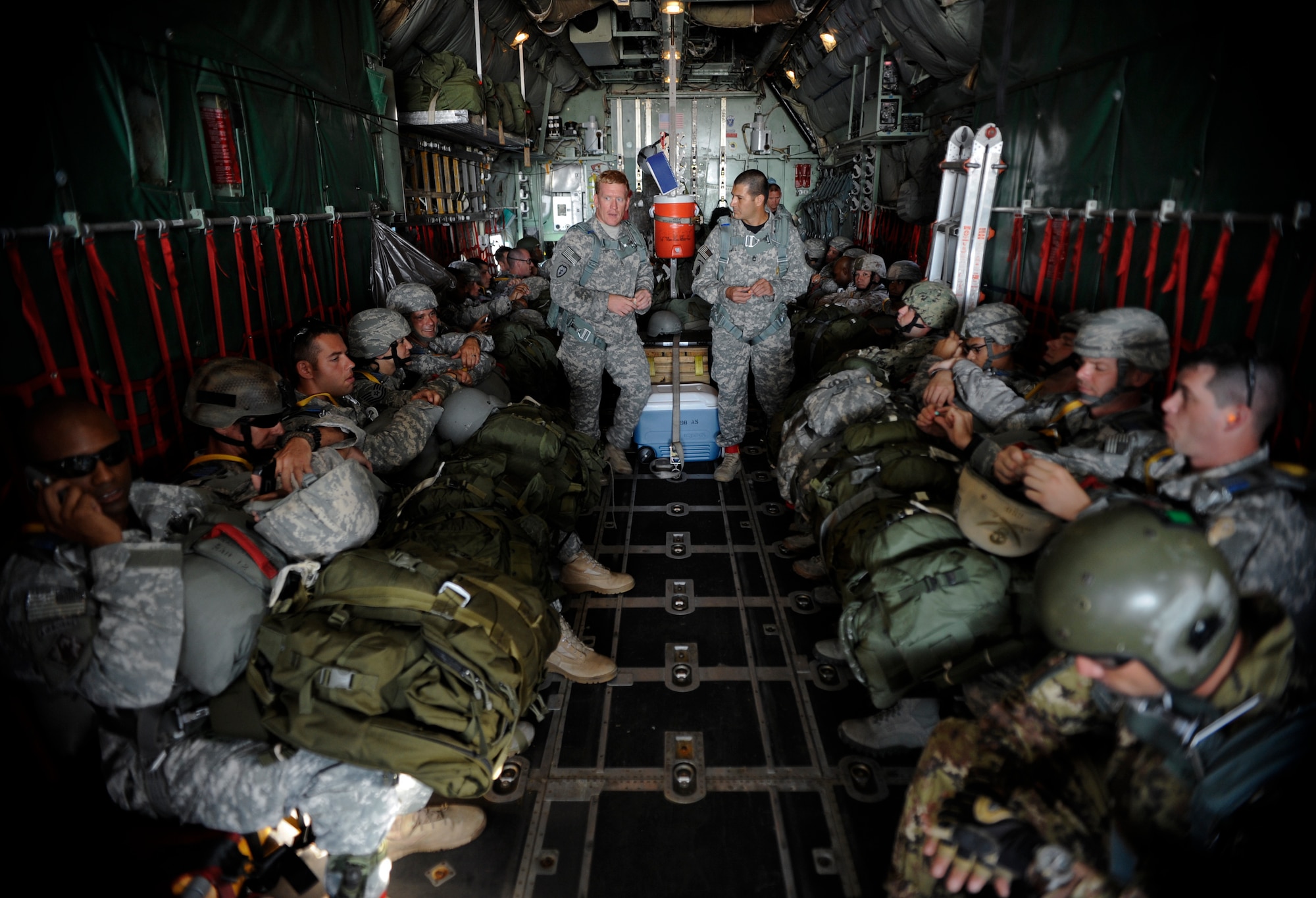 Parachute jumpers wait for the preparations for take-off to be completed May 21, 2014 at MacDill Air Force Base, Fla. This type of joint assignment is Tech. Sgt. Veronica Gatta’s, Joint Communications Support Element Direct Communications Support team chief, first in her career and has provided an extremely rare and motivating experience. (U.S. Air Force photo by Senior Airman Vernon L. Fowler Jr./Released)