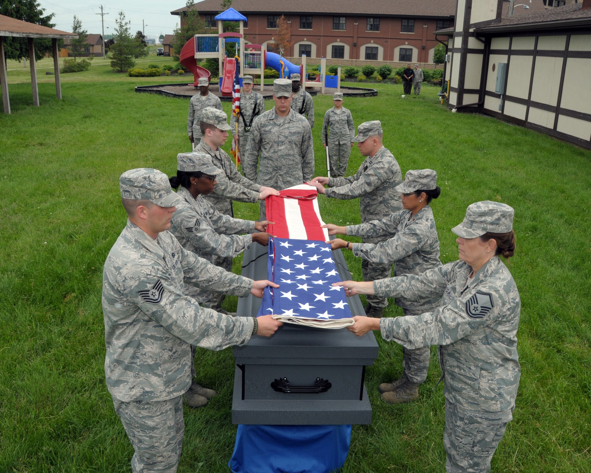 Air Force Reserve and Air National Guard members practice poll bearer training during a mock funeral ceremony on June 11, 2014 at the Niagara Falls Air Reserve Station, N.Y. Members from the 914th and 107th Airlift Wings as well as units from the rest of N.Y. and N.J. attended this unique eight day training conducted by instructors from the U.S. Air Force Honor Guard team, Joint Base Anacostia-Bolling, Washington, D.C. (U.S. Air Force photo by Peter Borys)
