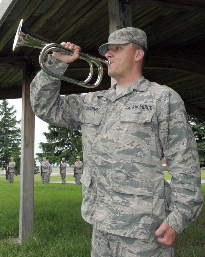 Tech. Sgt. Mark Dascomb, 107th Airlift Wing Honor Guard member plays Taps during a mock funeral ceremony on June 11, 2014 at the Niagara Falls Air Reserve Station, N.Y. Members of honor guard units from N.Y. and N.J. attended this unique eight day training conducted by instructors from the U.S. Air Force Honor Guard team, Joint base Anacostia-Bolling, Washington, D.C. (U.S. Air Force photo by Peter Borys)