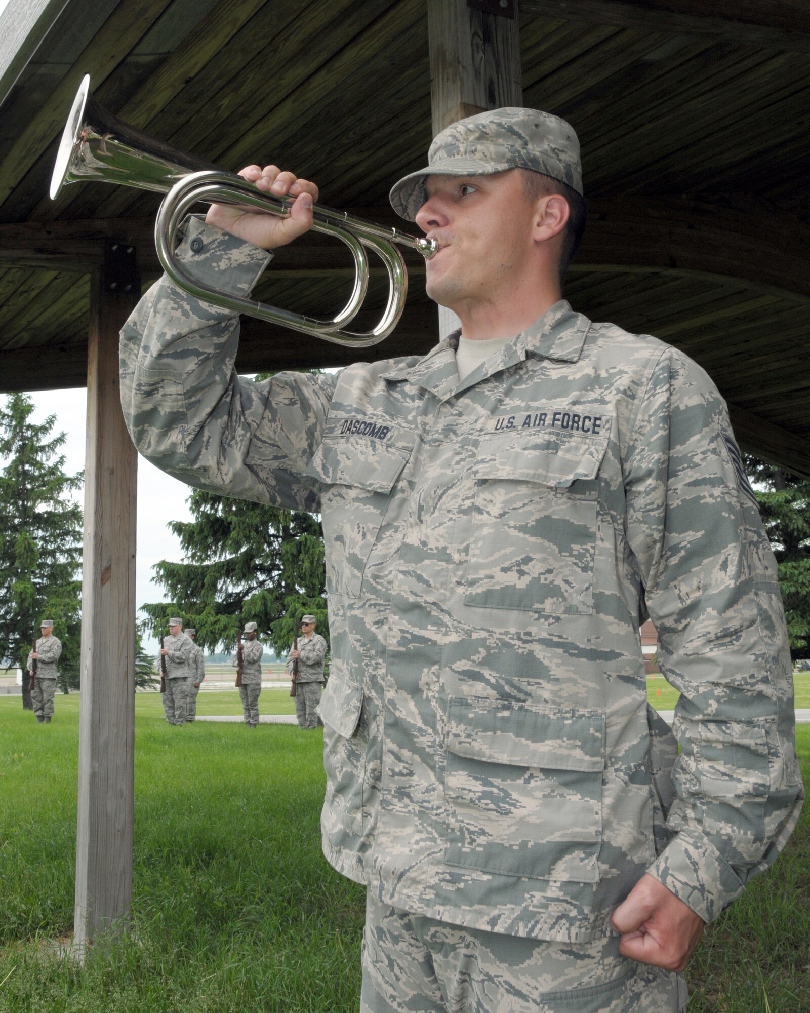 Tech. Sgt. Mark Dascomb, 107th Airlift Wing Honor Guard member plays Taps during a mock funeral ceremony on June 11, 2014 at the Niagara Falls Air Reserve Station, N.Y. Members of honor guard units from N.Y. and N.J. attended this unique eight day training conducted by instructors from the U.S. Air Force Honor Guard team, Joint base Anacostia-Bolling, Washington, D.C. (U.S. Air Force photo by Peter Borys)