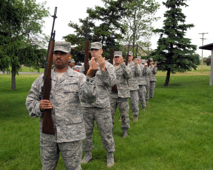 Master Sgt. Roland Gray(front), NCOIC of Optometry, 914th Aeromedical Staging Squadron and other honor guard members perform the 3 round volley during a mock funeral ceremony as part of firing party training for base honor guards on June 11, 2014 at the Niagara Falls Air Reserve Station, N.Y. Members of honor guard units from N.Y. and N.J. attended this unique eight day training conducted by instructors from the U.S. Air Force Honor Guard team, Joint base Anacostia-Bolling, Washington, D.C. (U.S. Air Force photo by Peter Borys)