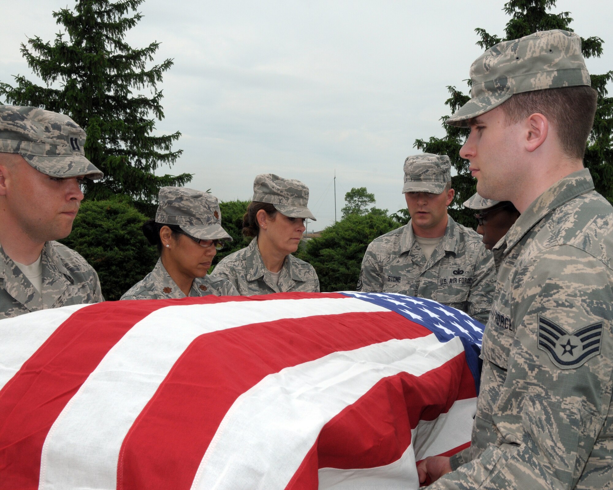 Air Force Reserve and Air National Guard members practice poll bearer training during a mock funeral ceremony on June 11, 2014 at the Niagara Falls Air Reserve Station, N.Y. Members from the 914th and 107th Airlift Wings as well as units from the rest of N.Y. and N.J. attended this unique eight day training conducted by instructors from the U.S. Air Force Honor Guard team, Joint Base Anacostia-Bolling, Washington, D.C. (U.S. Air Force photo by Peter Borys)